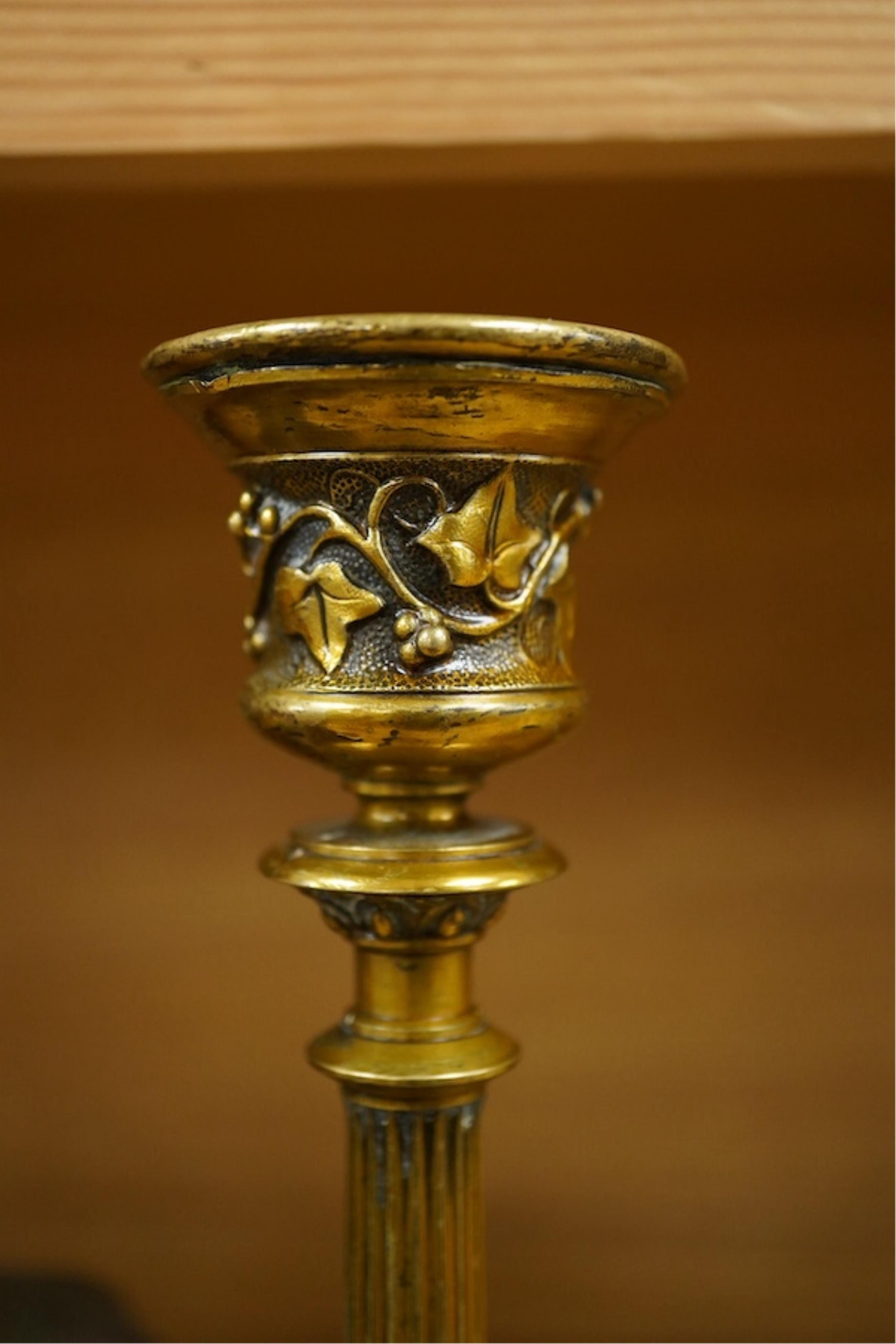A patinated copper study, 'American Brahman', inscribed EtC, together with a pair of 19th century ormolu candlesticks, largest 30cm high. Condition - fair, bull missing one horn